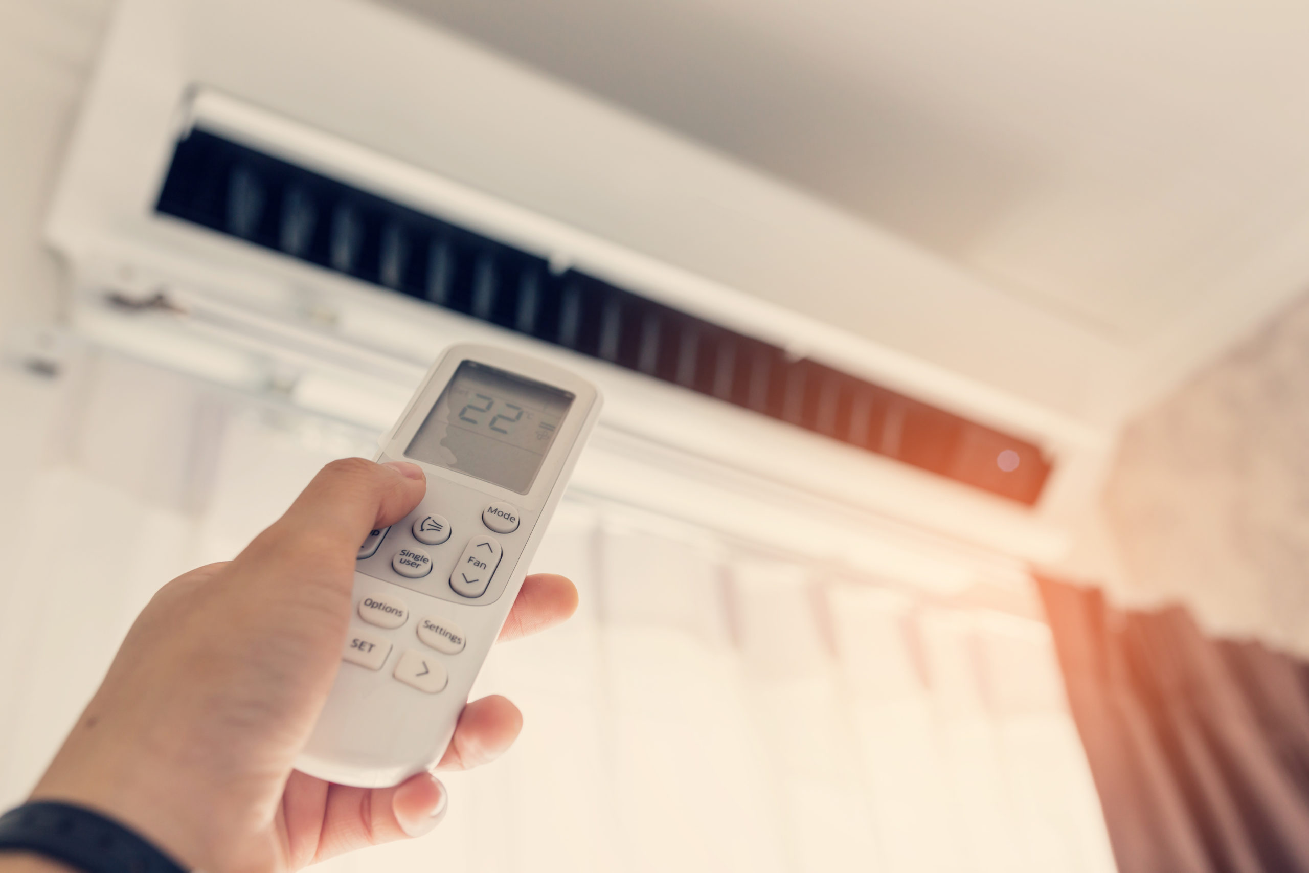 What does the “Cool” button on the air conditioning control mean?